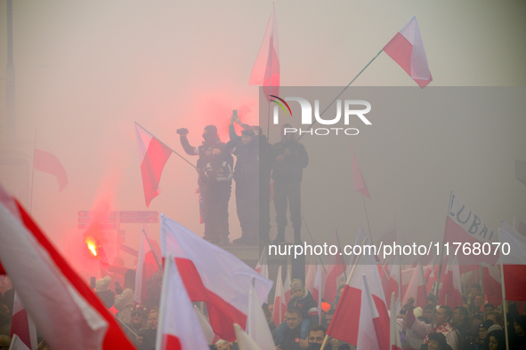 People take part in marking the 106th independence celebration in Warsaw, Poland on 11 November, 2024. A march organized by far-right, natio...