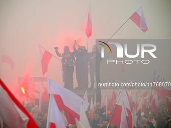 People take part in marking the 106th independence celebration in Warsaw, Poland on 11 November, 2024. A march organized by far-right, natio...