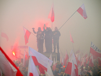 People take part in marking the 106th independence celebration in Warsaw, Poland on 11 November, 2024. A march organized by far-right, natio...