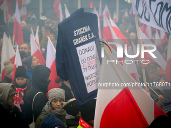 People take part in marking the 106th independence celebration in Warsaw, Poland on 11 November, 2024. A march organized by far-right, natio...