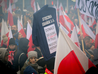 People take part in marking the 106th independence celebration in Warsaw, Poland on 11 November, 2024. A march organized by far-right, natio...