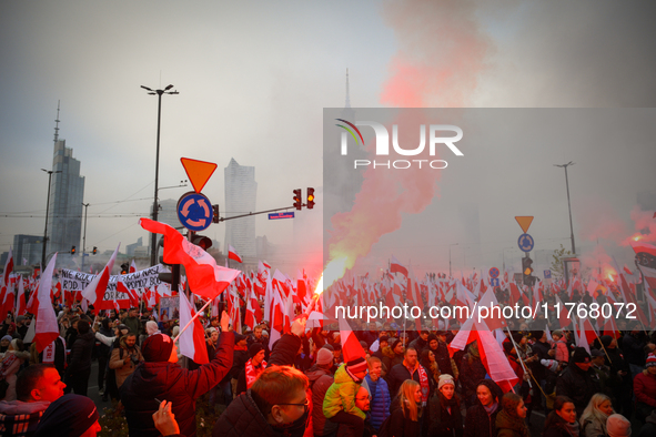 People take part in marking the 106th independence celebration in Warsaw, Poland on 11 November, 2024. A march organized by far-right, natio...