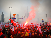 People take part in marking the 106th independence celebration in Warsaw, Poland on 11 November, 2024. A march organized by far-right, natio...