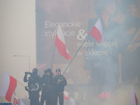 People take part in marking the 106th independence celebration in Warsaw, Poland on 11 November, 2024. A march organized by far-right, natio...