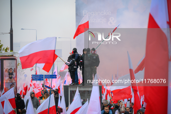 People take part in marking the 106th independence celebration in Warsaw, Poland on 11 November, 2024. A march organized by far-right, natio...