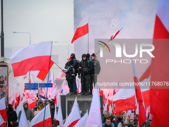 People take part in marking the 106th independence celebration in Warsaw, Poland on 11 November, 2024. A march organized by far-right, natio...