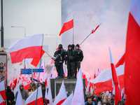 People take part in marking the 106th independence celebration in Warsaw, Poland on 11 November, 2024. A march organized by far-right, natio...