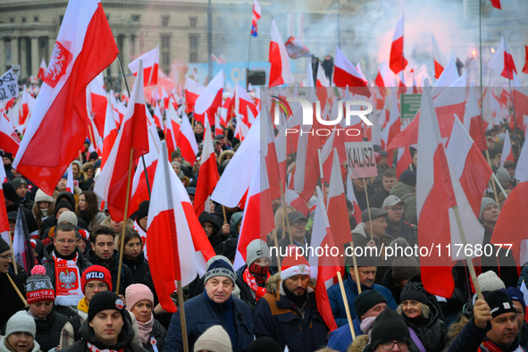 People take part in marking the 106th independence celebration in Warsaw, Poland on 11 November, 2024. A march organized by far-right, natio...