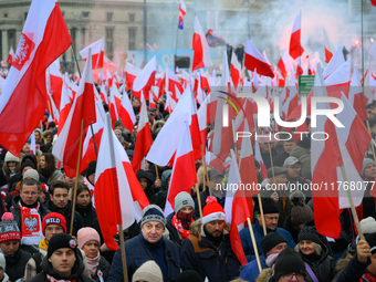 People take part in marking the 106th independence celebration in Warsaw, Poland on 11 November, 2024. A march organized by far-right, natio...