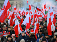 People take part in marking the 106th independence celebration in Warsaw, Poland on 11 November, 2024. A march organized by far-right, natio...