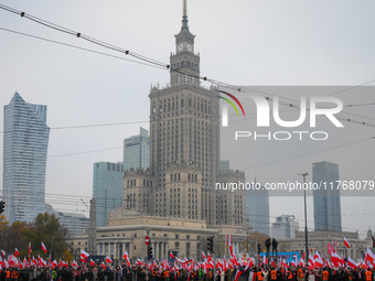 People take part in marking the 106th independence celebration in Warsaw, Poland on 11 November, 2024. A march organized by far-right, natio...