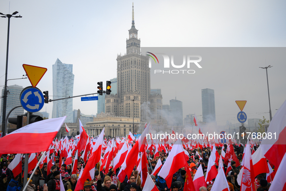 People take part in marking the 106th independence celebration in Warsaw, Poland on 11 November, 2024. A march organized by far-right, natio...