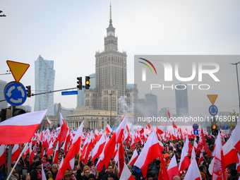 People take part in marking the 106th independence celebration in Warsaw, Poland on 11 November, 2024. A march organized by far-right, natio...