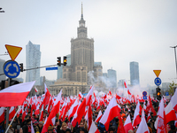 People take part in marking the 106th independence celebration in Warsaw, Poland on 11 November, 2024. A march organized by far-right, natio...