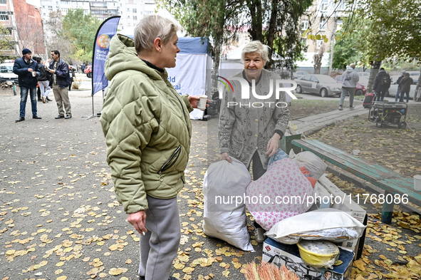 Elderly women talk by salvaged belongings outside a hostel where internally displaced persons live, damaged by an overnight Russian air stri...