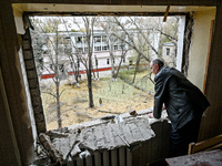 In Zaporizhzhia, Ukraine, on November 11, 2024, a man looks out of a knocked-out window in a room of a hostel where internally displaced per...