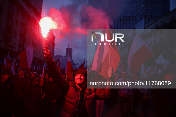 People attend Independence March celebrating the 106 anniversary of Poland regaining independence. Warsaw, Poland on 11 November, 2024. Tens...