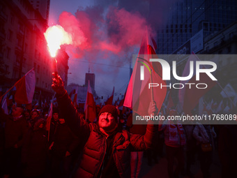 People attend Independence March celebrating the 106 anniversary of Poland regaining independence. Warsaw, Poland on 11 November, 2024. Tens...