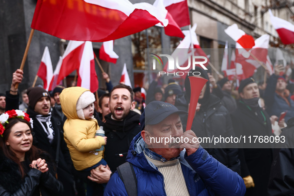 People attend Independence March celebrating the 106 anniversary of Poland regaining independence. Warsaw, Poland on 11 November, 2024. Tens...