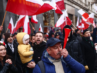 People attend Independence March celebrating the 106 anniversary of Poland regaining independence. Warsaw, Poland on 11 November, 2024. Tens...