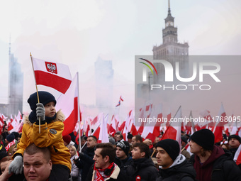 People attend Independence March celebrating the 106 anniversary of Poland regaining independence. Warsaw, Poland on 11 November, 2024. Tens...