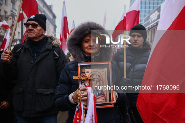 People attend Independence March celebrating the 106 anniversary of Poland regaining independence. Warsaw, Poland on 11 November, 2024. Tens...