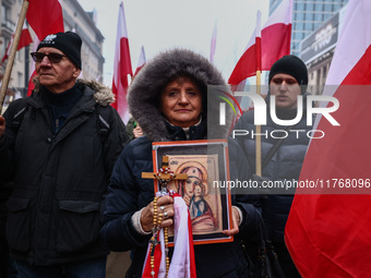 People attend Independence March celebrating the 106 anniversary of Poland regaining independence. Warsaw, Poland on 11 November, 2024. Tens...