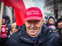 A man wears 'Make Poland Great Again' cap while attending Independence March celebrating the 106 anniversary of Poland regaining independenc...