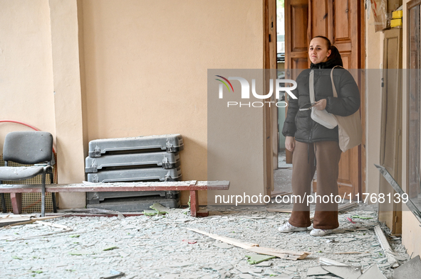 A woman looks with sadness at a gym in the sports complex of the Zaporizhzhia Polytechnic National University, which is damaged by an overni...