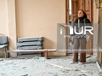 A woman looks with sadness at a gym in the sports complex of the Zaporizhzhia Polytechnic National University, which is damaged by an overni...