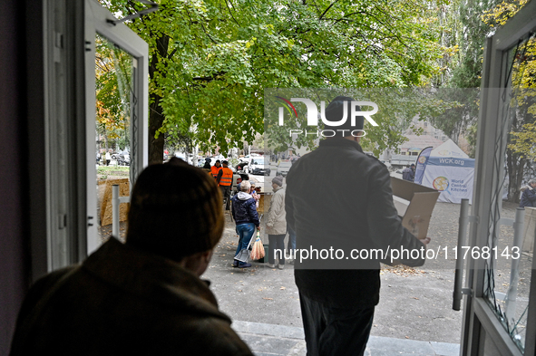 Residents of a hostel for internally displaced persons, damaged by an overnight Russian air strike, recover after the attack in Zaporizhzhia...