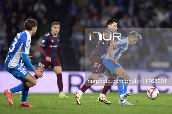 Xeber Alkain of SD Eibar competes for the ball with Yeremay Hernandez of RC Deportivo de La Coruna during the LaLiga Hypermotion match betwe...