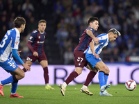 Xeber Alkain of SD Eibar competes for the ball with Yeremay Hernandez of RC Deportivo de La Coruna during the LaLiga Hypermotion match betwe...