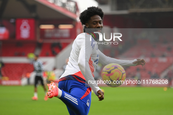 Ola Aina of Nottingham Forest warms up ahead of kick-off during the Premier League match between Nottingham Forest and Newcastle United at t...