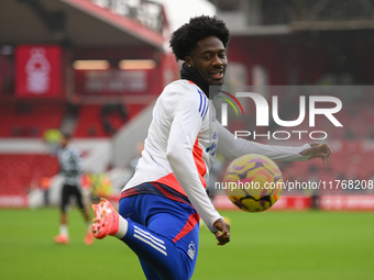 Ola Aina of Nottingham Forest warms up ahead of kick-off during the Premier League match between Nottingham Forest and Newcastle United at t...