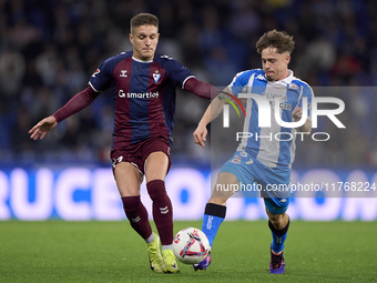 Jose Corpas of SD Eibar competes for the ball with Mario Soriano of RC Deportivo de La Coruna during the LaLiga Hypermotion match between RC...