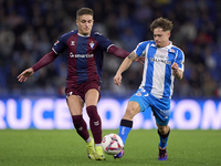 Jose Corpas of SD Eibar competes for the ball with Mario Soriano of RC Deportivo de La Coruna during the LaLiga Hypermotion match between RC...