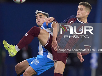 Jose Corpas of SD Eibar competes for the ball with Yeremay Hernandez of RC Deportivo de La Coruna during the LaLiga Hypermotion match betwee...