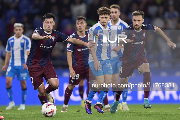 Xeber Alkain of SD Eibar competes for the ball with Mario Soriano of RC Deportivo de La Coruna during the LaLiga Hypermotion match between R...