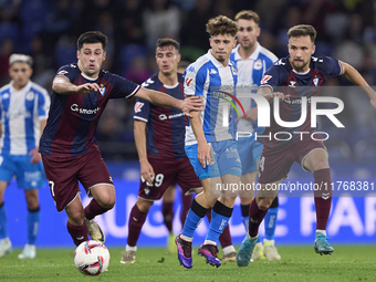 Xeber Alkain of SD Eibar competes for the ball with Mario Soriano of RC Deportivo de La Coruna during the LaLiga Hypermotion match between R...