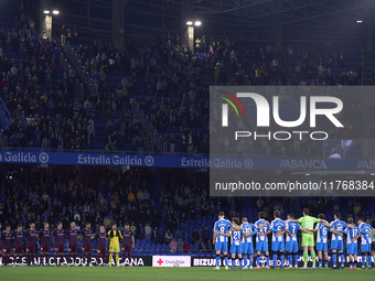 Players of RC Deportivo de La Coruna and players of SD Eibar observe a minute's silence in support of the Valencia flooding victims prior to...