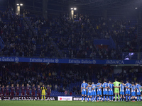 Players of RC Deportivo de La Coruna and players of SD Eibar observe a minute's silence in support of the Valencia flooding victims prior to...