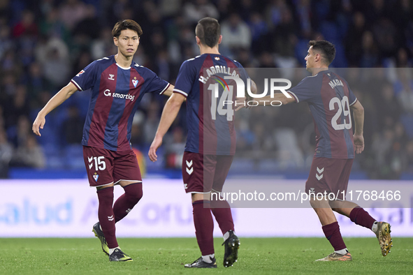 Kento Hashimoto of SD Eibar shakes hands with Ander Madariaga and Hodei Arrillaga during the LaLiga Hypermotion match between RC Deportivo d...