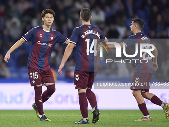 Kento Hashimoto of SD Eibar shakes hands with Ander Madariaga and Hodei Arrillaga during the LaLiga Hypermotion match between RC Deportivo d...