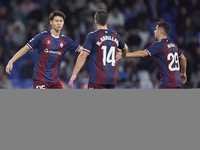 Kento Hashimoto of SD Eibar shakes hands with Ander Madariaga and Hodei Arrillaga during the LaLiga Hypermotion match between RC Deportivo d...