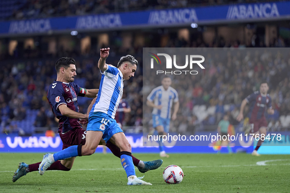 Sergio Alvarez of SD Eibar competes for the ball with Yeremay Hernandez of RC Deportivo de La Coruna during the LaLiga Hypermotion match bet...