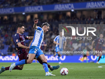 Sergio Alvarez of SD Eibar competes for the ball with Yeremay Hernandez of RC Deportivo de La Coruna during the LaLiga Hypermotion match bet...