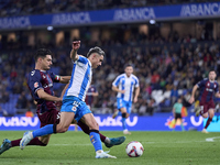 Sergio Alvarez of SD Eibar competes for the ball with Yeremay Hernandez of RC Deportivo de La Coruna during the LaLiga Hypermotion match bet...