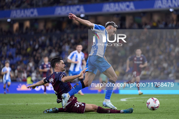 Sergio Alvarez of SD Eibar competes for the ball with Yeremay Hernandez of RC Deportivo de La Coruna during the LaLiga Hypermotion match bet...