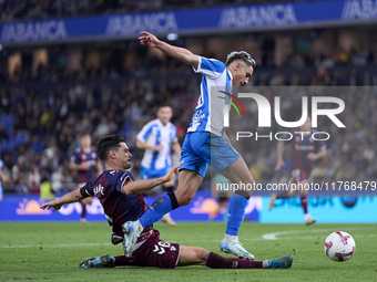 Sergio Alvarez of SD Eibar competes for the ball with Yeremay Hernandez of RC Deportivo de La Coruna during the LaLiga Hypermotion match bet...